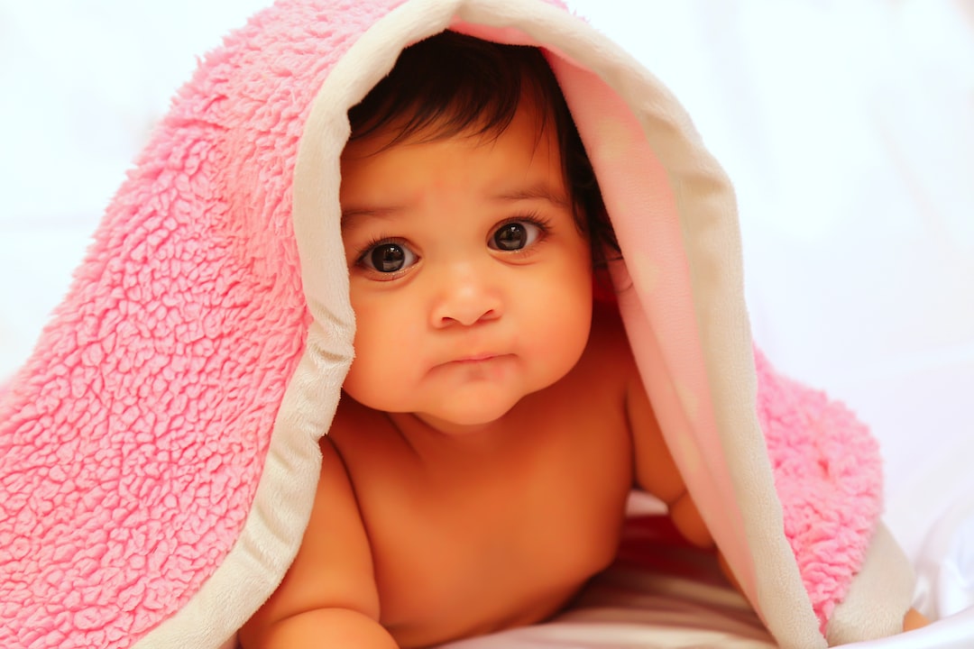 baby covered with pink fleece blanket YwFS ZpVZ2Q jpg
