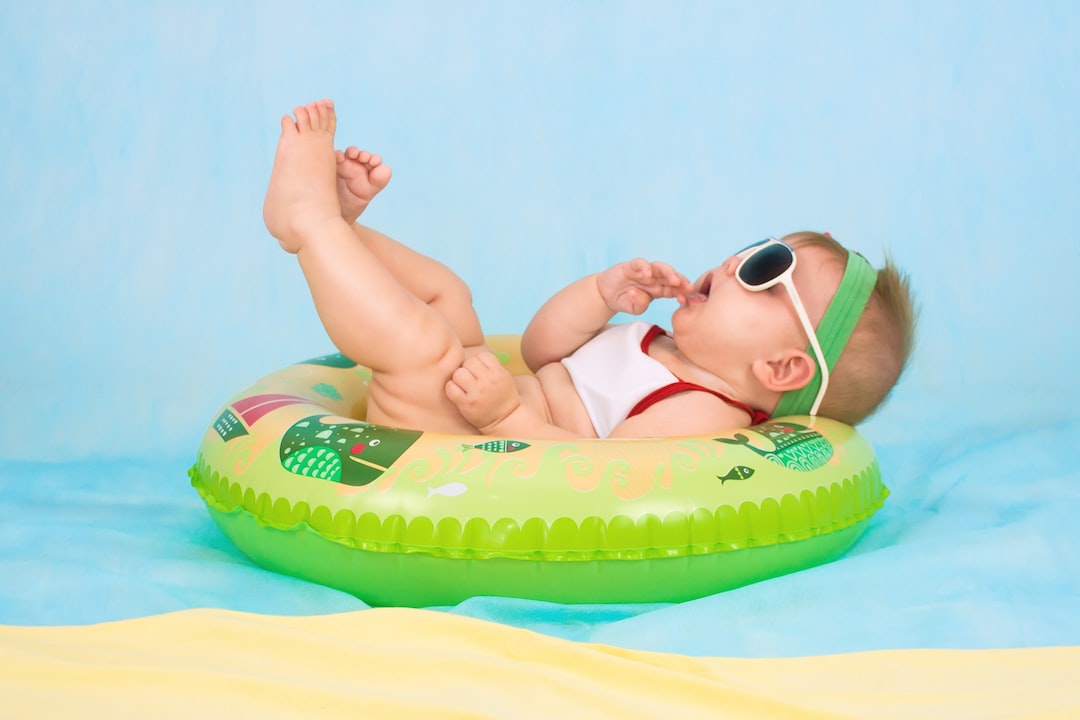 baby lying on inflatable ring AVGc87j vNA jpg
