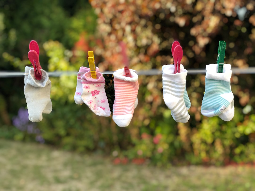 five pairs of socks pinned on clothesline MDIGo4Ez 0g jpg